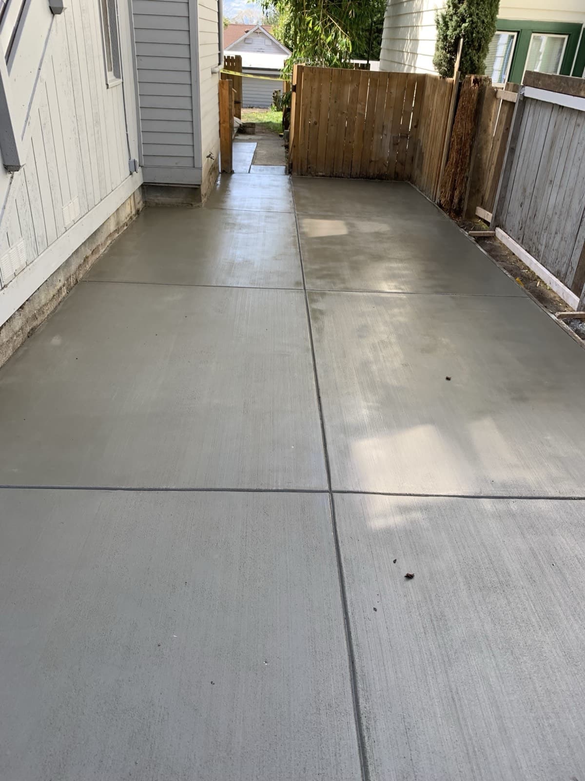 Fenced patio pour